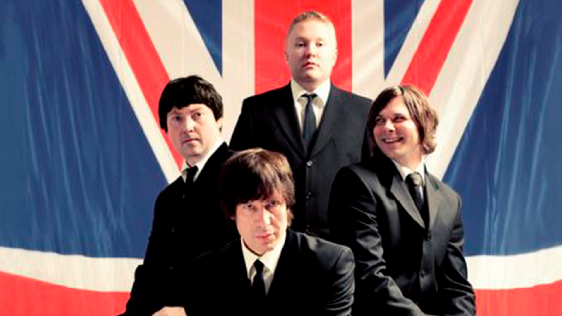 Yhtye Jiri Nikkinen the Beatles Tribute Band ryhmäkuvassa.